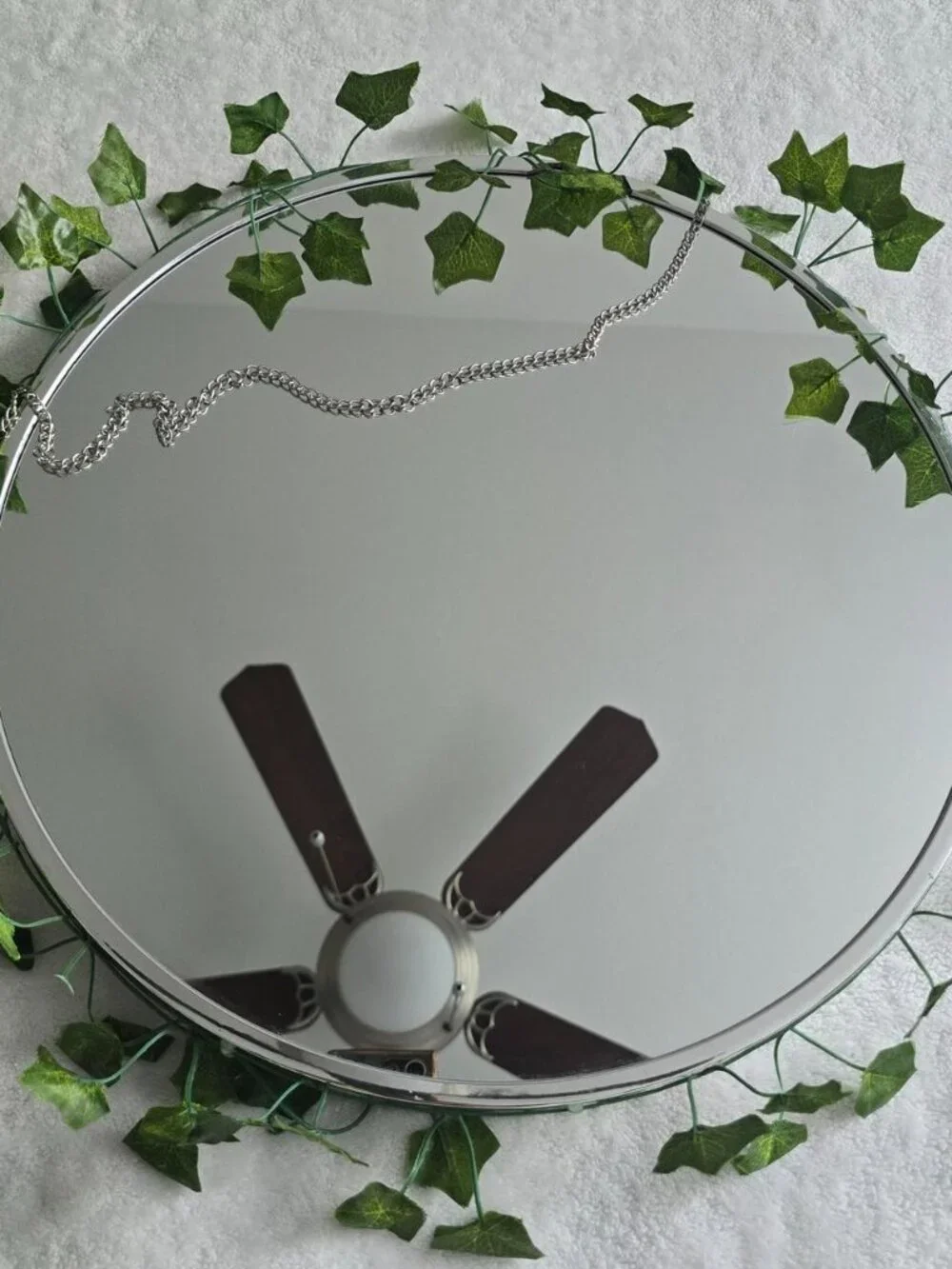 Faux ivy leaf circle mirror with chain detail